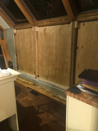 The same sunroom space mid-renovation, before the finished build